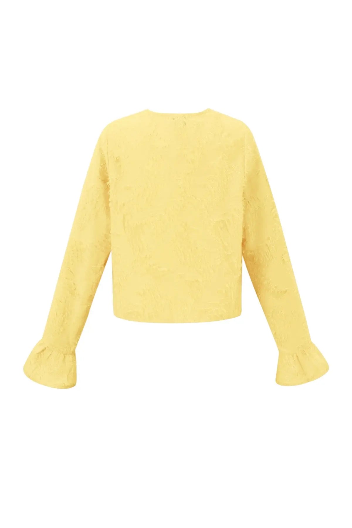 Achterkant lichtgele blouse met strikjes en textuur. Lange mouwen met licht uitlopende mouwen.